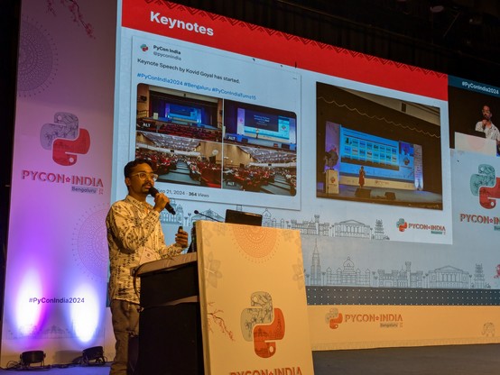 Bhavin delivering the closing address for day 1 in PyCon India. The slide has pictures from the conference.